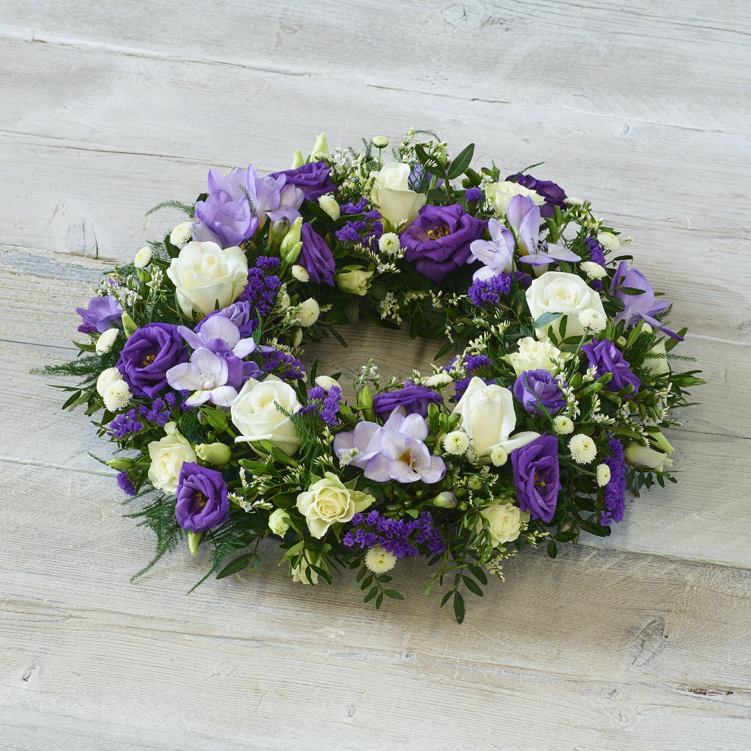 Sympathy Basket with mixed seasonal flowers and foliage