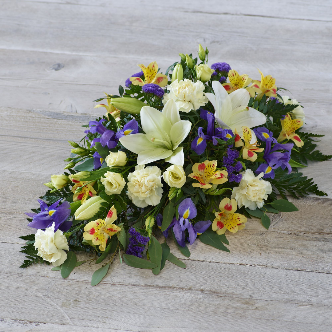Floral Pillow tribute with pastel roses and lavender accents