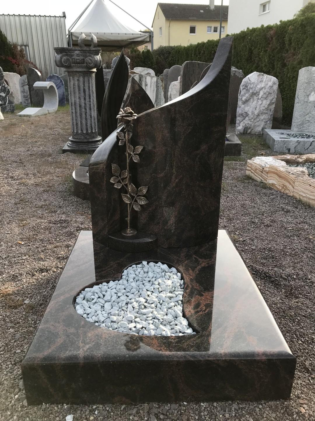 Heart-shaped memorial with polished red granite and gold lettering
